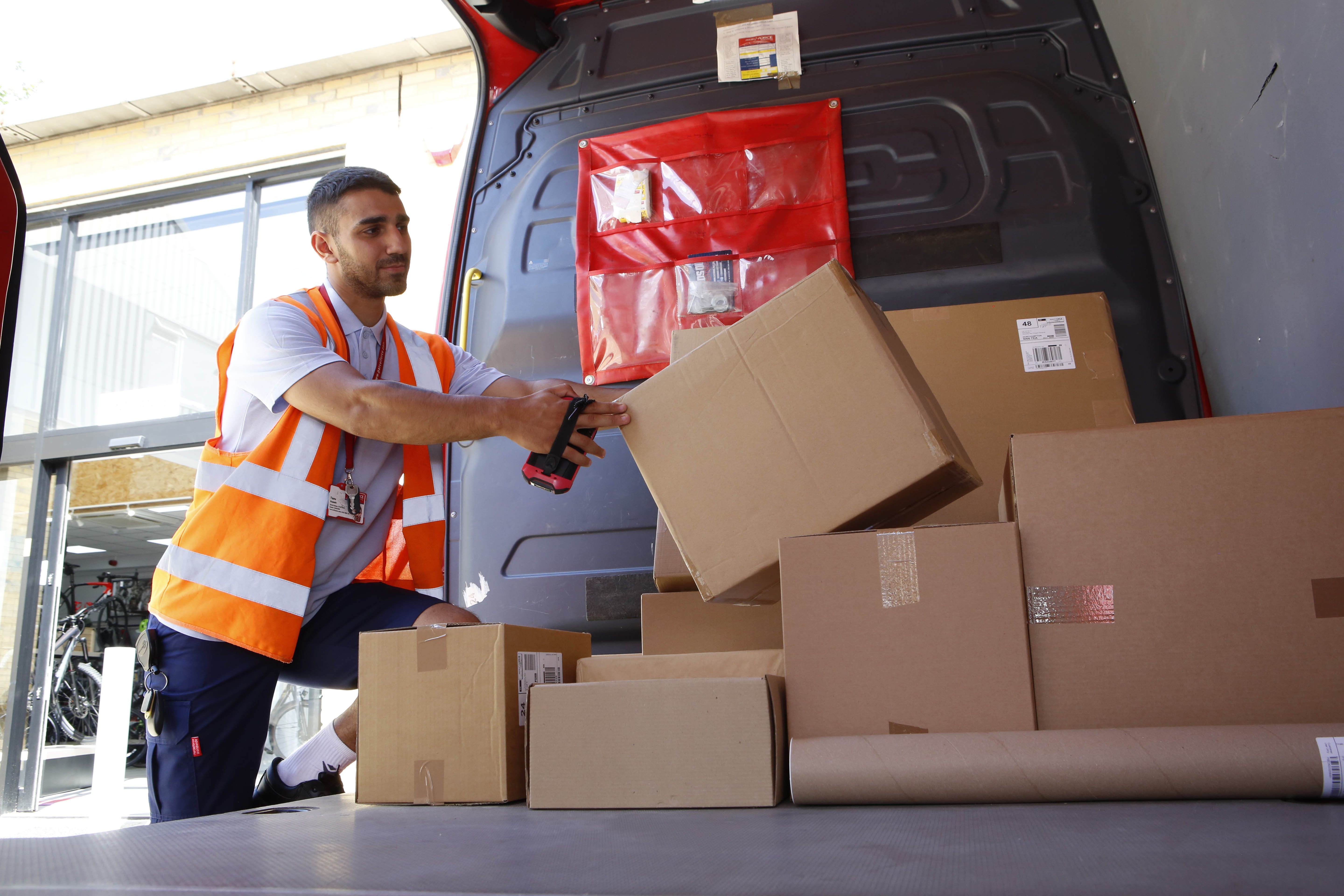 Driver loading parcels