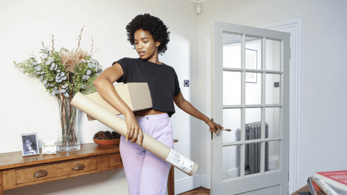 Woman packing parcel