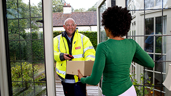 doorstep delivery postie with a woman